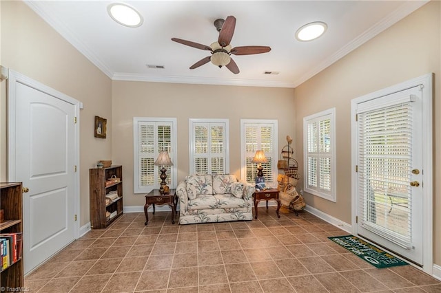 sitting room with ceiling fan and ornamental molding