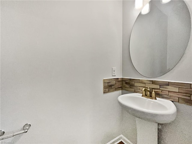 bathroom with tasteful backsplash