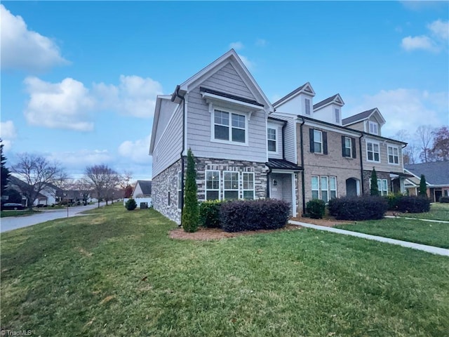 5810 Crestlawn Ct, Pfafftown, NC 27040 - view of front facade featuring stone siding and a front lawn