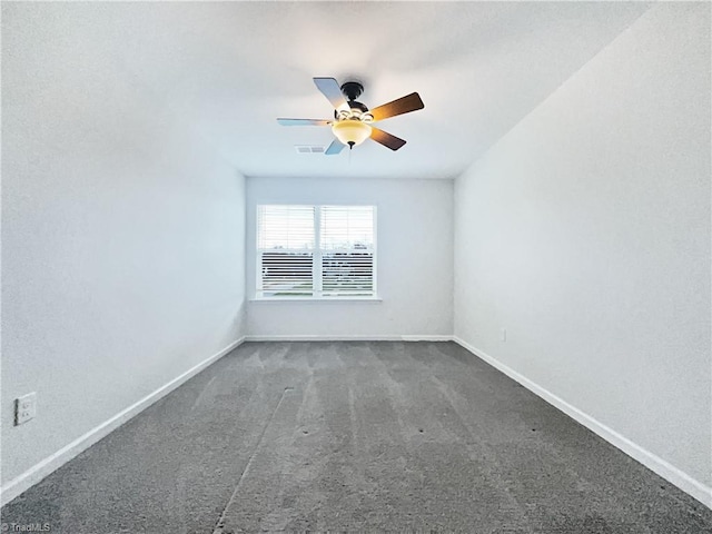 5810 Crestlawn Ct, Pfafftown, NC 27040 - unfurnished room with a ceiling fan, carpet floors, and baseboards