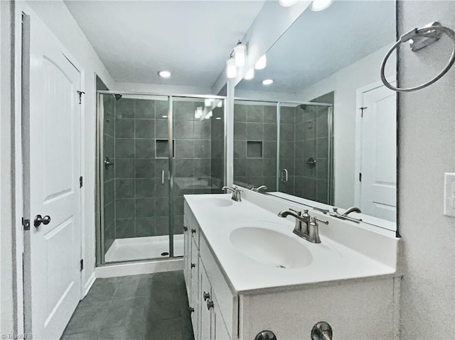 5810 Crestlawn Ct, Pfafftown, NC 27040 - bathroom with double vanity, a shower stall, tile patterned flooring, and recessed lighting