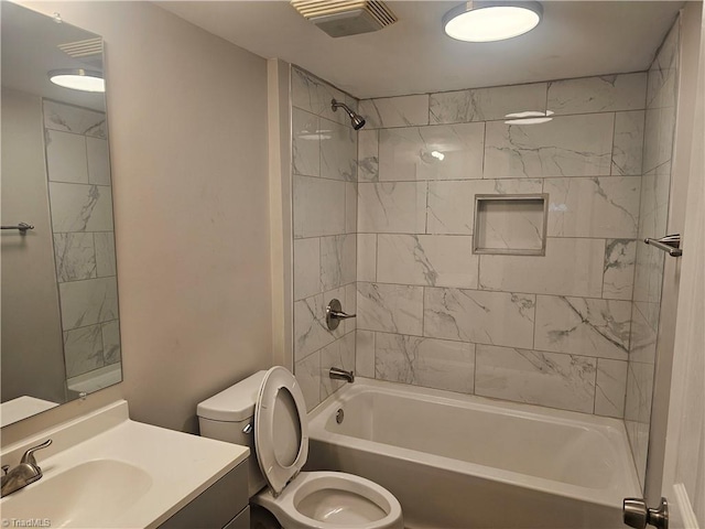 bathroom with vanity, toilet, shower / tub combination, and visible vents
