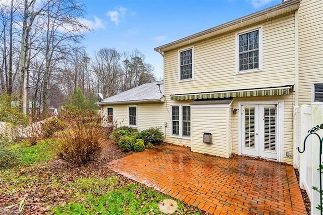 back of property featuring a patio area