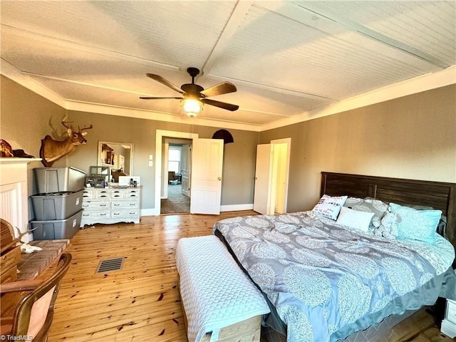 327 S Carolina Ave, Boonville, NC 27011 - bedroom featuring wood-type flooring, baseboards, a ceiling fan, and ornamental molding