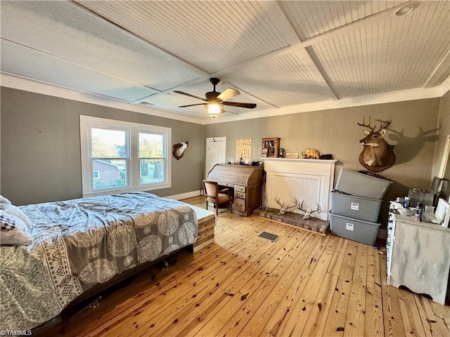 327 S Carolina Ave, Boonville, NC 27011 - bedroom with coffered ceiling, light wood-style flooring, a ceiling fan, and baseboards