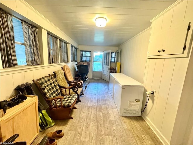327 S Carolina Ave, Boonville, NC 27011 - laundry area featuring light wood-style floors and ornamental molding
