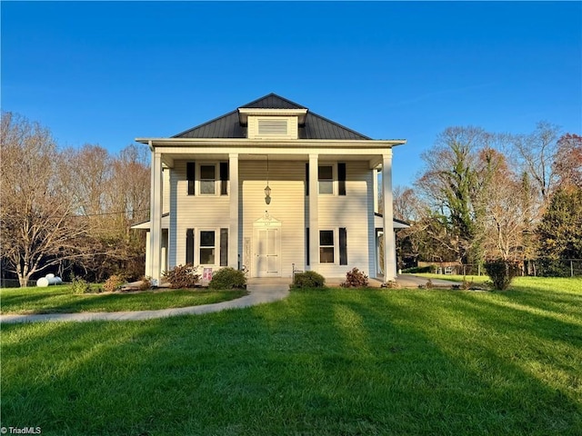 327 S Carolina Ave, Boonville, NC 27011 - neoclassical home with a front yard, a standing seam roof, and metal roof