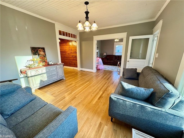 327 S Carolina Ave, Boonville, NC 27011 - living room featuring a chandelier, light wood finished floors, crown molding, and baseboards