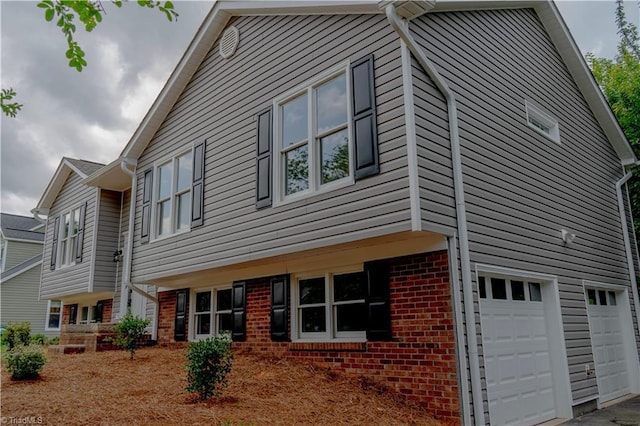 9048 Jefferson Woods Dr, King, NC 27045 - view of side of property with brick siding and a garage