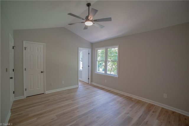 9048 Jefferson Woods Dr, King, NC 27045 - empty room featuring ceiling fan, light wood finished floors, and vaulted ceiling