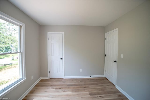 9048 Jefferson Woods Dr, King, NC 27045 - empty room featuring light wood-style floors and baseboards