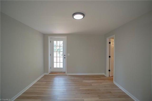 9048 Jefferson Woods Dr, King, NC 27045 - doorway to outside with light wood-style flooring and baseboards