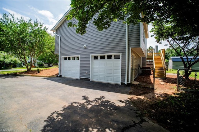 9048 Jefferson Woods Dr, King, NC 27045 - view of property exterior featuring asphalt driveway and stairway