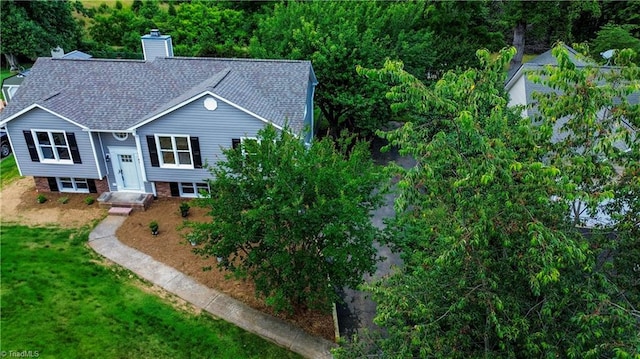 9048 Jefferson Woods Dr, King, NC 27045 - view of front of property with a chimney, roof with shingles, and a front lawn