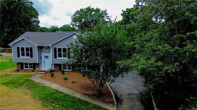 9048 Jefferson Woods Dr, King, NC 27045 - bi-level home with a front lawn and roof with shingles