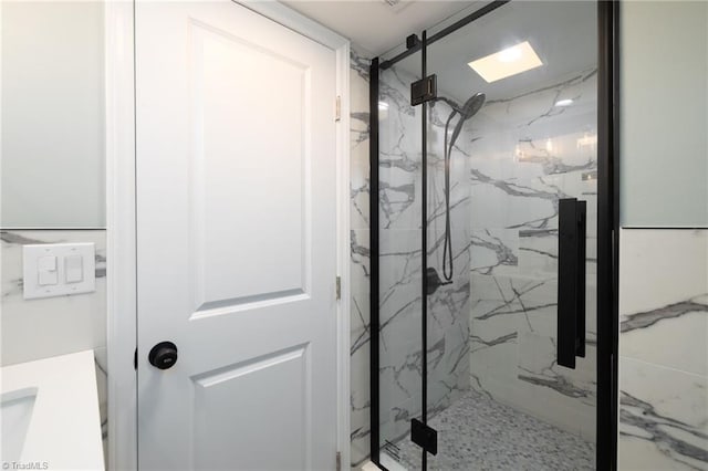 interior details featuring tiled shower