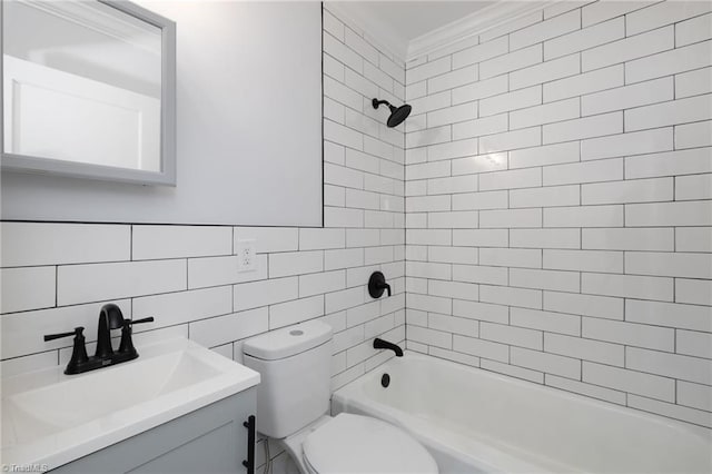 full bathroom with vanity, toilet, tiled shower / bath combo, and tile walls