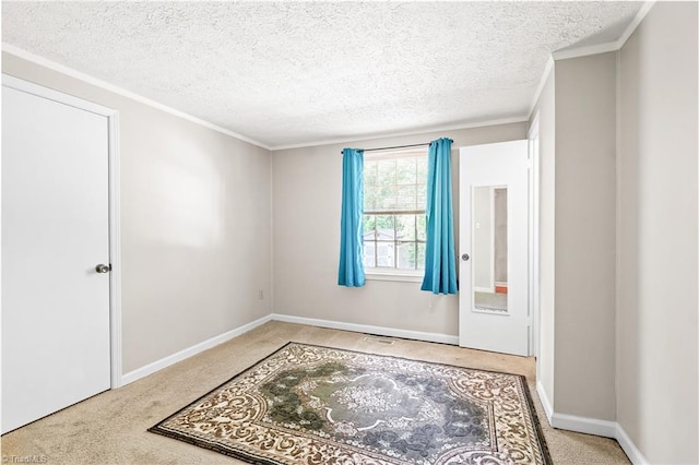 1765 K Fork Rd, Madison, NC 27025 - empty room with carpet, a textured ceiling, baseboards, and ornamental molding