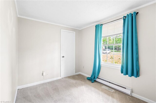 1765 K Fork Rd, Madison, NC 27025 - empty room featuring carpet, crown molding, a baseboard radiator, and baseboards