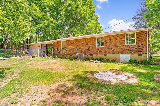 1765 K Fork Rd, Madison, NC 27025 - rear view of property with crawl space, central air condition unit, brick siding, and a chimney