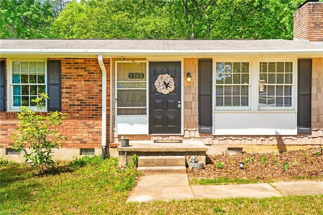 1765 K Fork Rd, Madison, NC 27025 - doorway to property featuring crawl space, brick siding, and a chimney