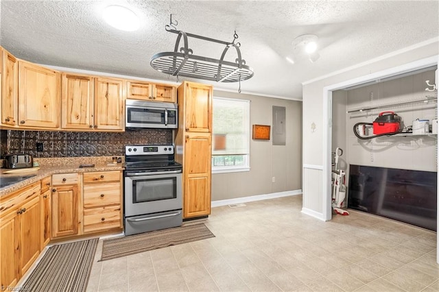 1765 K Fork Rd, Madison, NC 27025 - kitchen with appliances with stainless steel finishes, electric panel, a textured ceiling, tasteful backsplash, and baseboards
