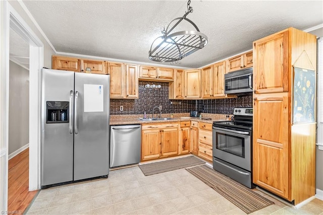 1765 K Fork Rd, Madison, NC 27025 - kitchen with stainless steel appliances, a sink, decorative backsplash, crown molding, and a textured ceiling