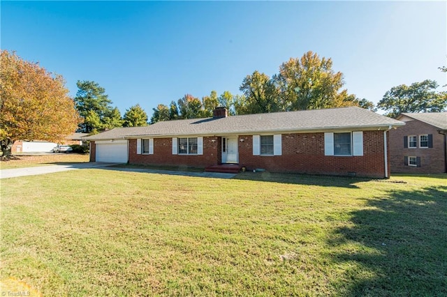 ranch-style house featuring a garage and a front lawn