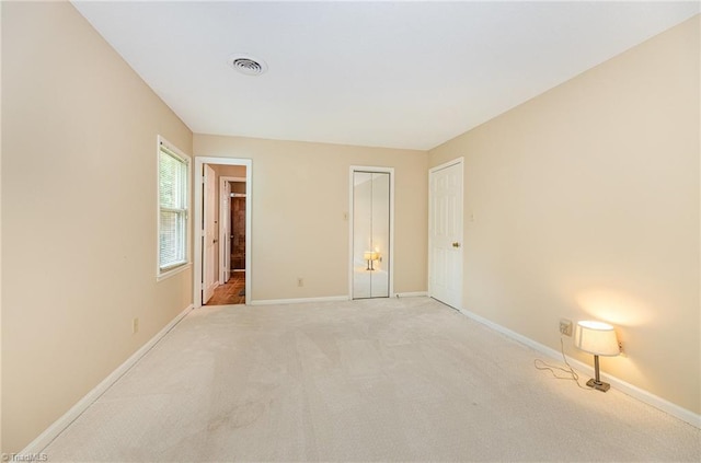 1601 Heraldry Ln, Greensboro, NC 27455 - unfurnished bedroom with light carpet and ensuite bath