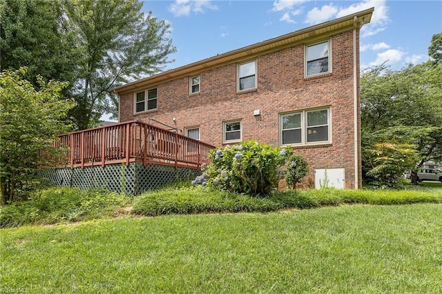 1601 Heraldry Ln, Greensboro, NC 27455 - rear view of property with a lawn, a deck, and brick siding