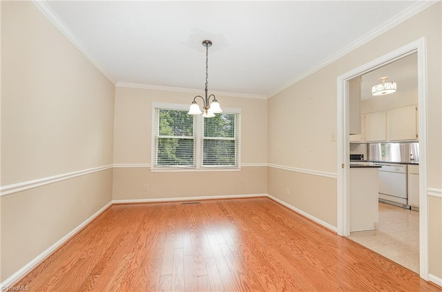 1601 Heraldry Ln, Greensboro, NC 27455 - unfurnished dining area with a chandelier, light wood finished floors, and crown molding