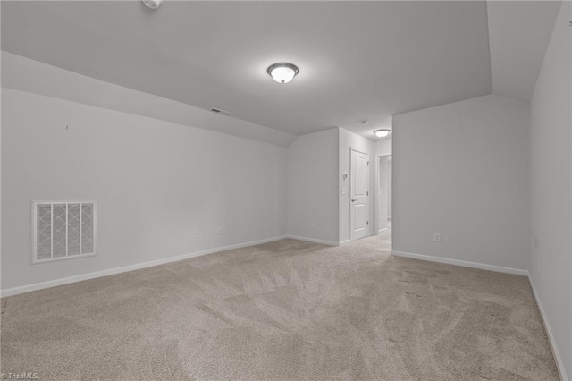 bonus room featuring light colored carpet, baseboards, and visible vents