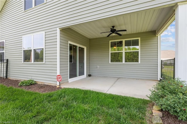 view of patio / terrace with fence and ceiling fan
