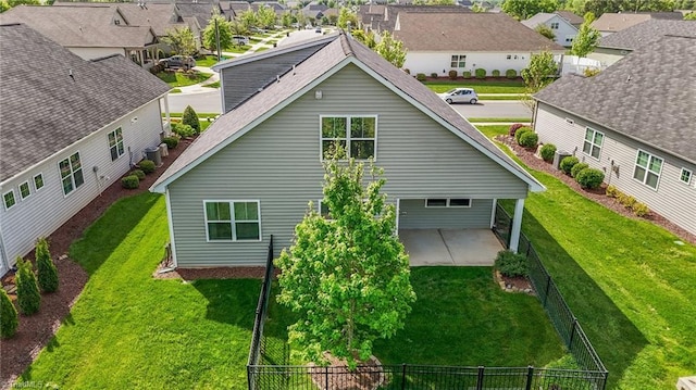 birds eye view of property with a residential view
