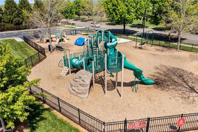 view of property's community featuring fence and playground community