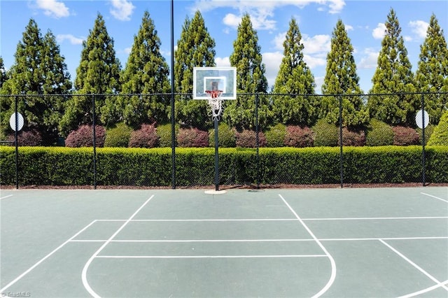 view of sport court featuring community basketball court and fence