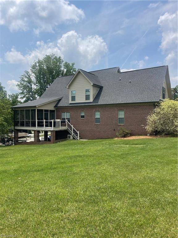 375 Pebblestone Ct, Lexington, NC 27295 - rear view of property featuring a sunroom, a yard, and a shingled roof