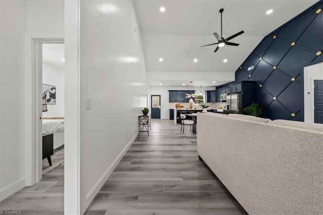 7126 Whitetail Dr, Julian, NC 27283 - hall featuring recessed lighting, baseboards, light wood-type flooring, and lofted ceiling