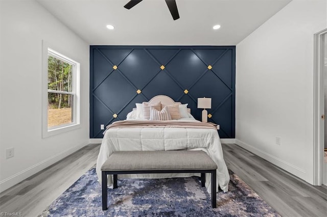 7126 Whitetail Dr, Julian, NC 27283 - bedroom with baseboards, recessed lighting, light wood finished floors, and a decorative wall