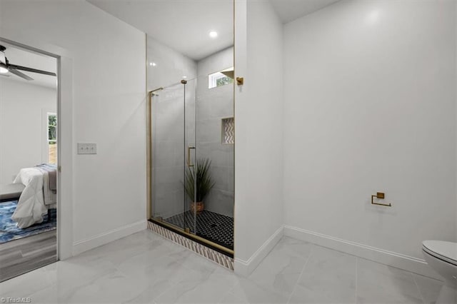 7126 Whitetail Dr, Julian, NC 27283 - ensuite bathroom featuring a shower stall, baseboards, toilet, marble finish floor, and ensuite bathroom