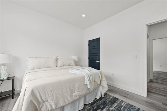 7126 Whitetail Dr, Julian, NC 27283 - bedroom featuring baseboards, recessed lighting, and wood finished floors