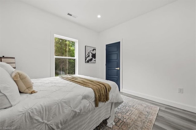 7126 Whitetail Dr, Julian, NC 27283 - bedroom with recessed lighting, baseboards, visible vents, and wood finished floors