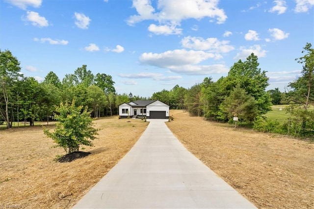 7126 Whitetail Dr, Julian, NC 27283 - view of community with an attached garage and driveway