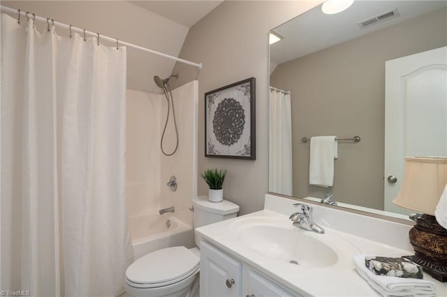 bathroom featuring shower / bath combination with curtain, visible vents, vanity, and toilet