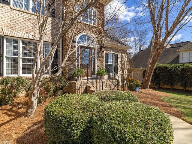 view of front of house with brick siding