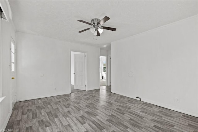 spare room featuring hardwood / wood-style flooring and ceiling fan