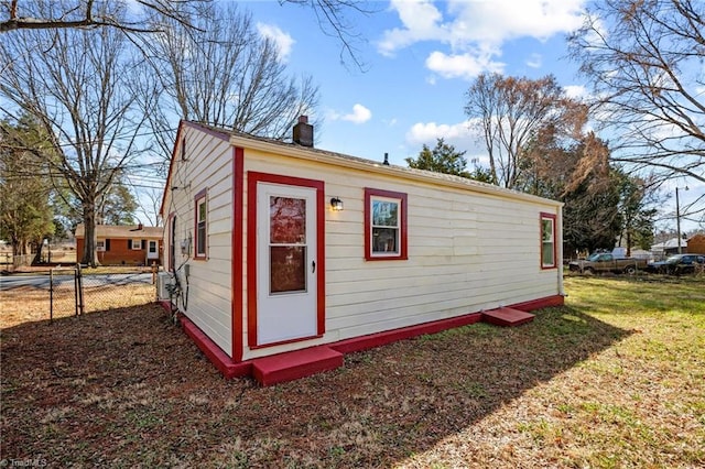 view of outbuilding with a yard