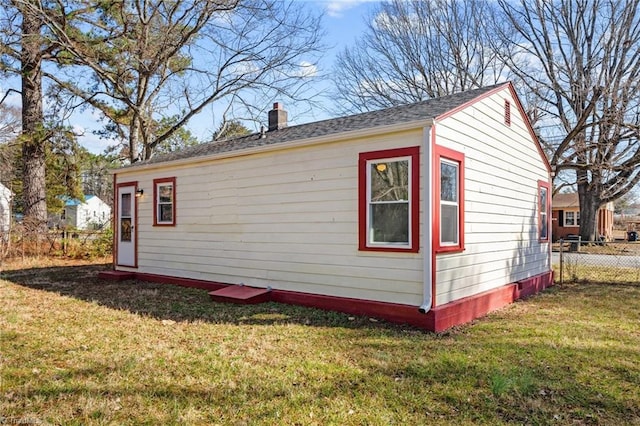 view of outdoor structure featuring a yard