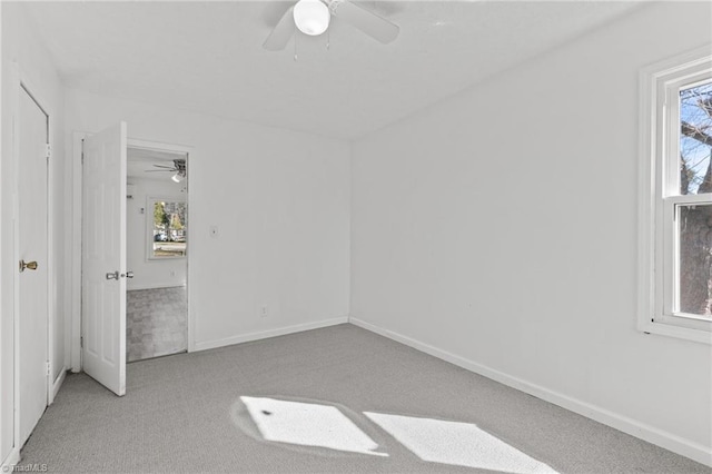 unfurnished bedroom featuring ceiling fan and light carpet