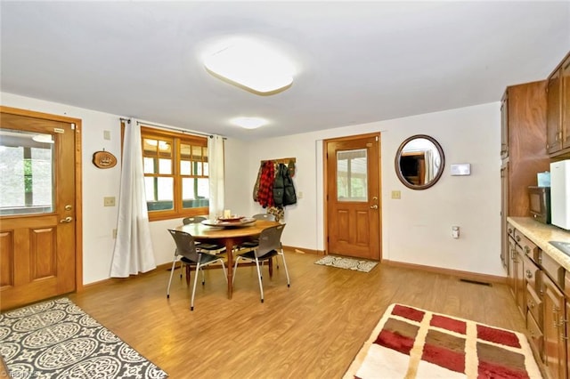 140 Blue Heron Ln, Wilkesboro, NC 28697 - entrance foyer with light wood-style flooring, baseboards, and plenty of natural light